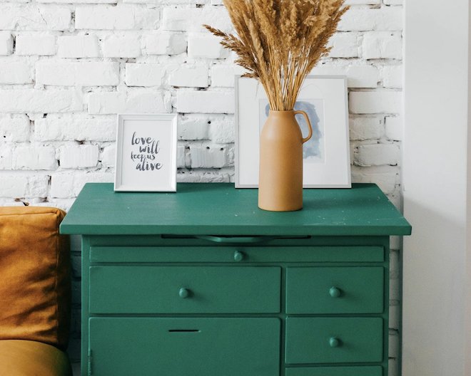 Green dresser with decor